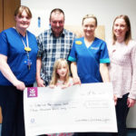 Caoimhe Lynch with her parents Kevin and Lorraine presenting the progeeds of th Christman lights fundraiser to clinical midwife managers Margo Dunworth and Deirdre O'Connell university hospital limerick maternity