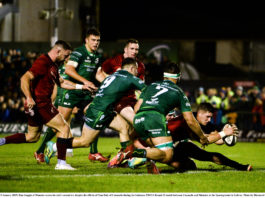 Dan Goggin of Munster scores his side's second try despite the efforts of Tom Daly of Connacht during the Guinness PRO14 Round 13 match between Connacht and Munster at the Sportsground in Galway. Photo by Diarmuid Greene/Sportsfile