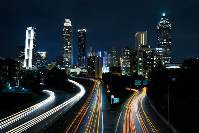 time lapse photo of passing cars during night time