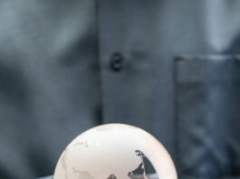 shallow focus photo of clear glass globe table ornament