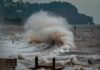 sea waves crashing on shore during daytime