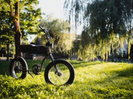 black and gray motorcycle on green grass field during daytime