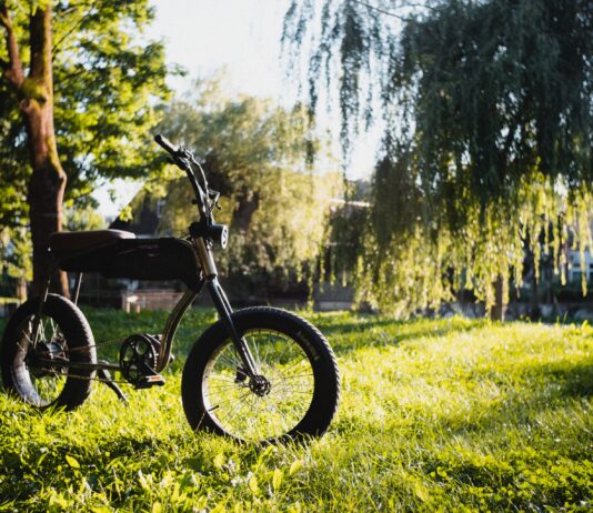 black and gray motorcycle on green grass field during daytime