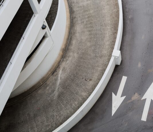 aerial photography of road with arrow signs